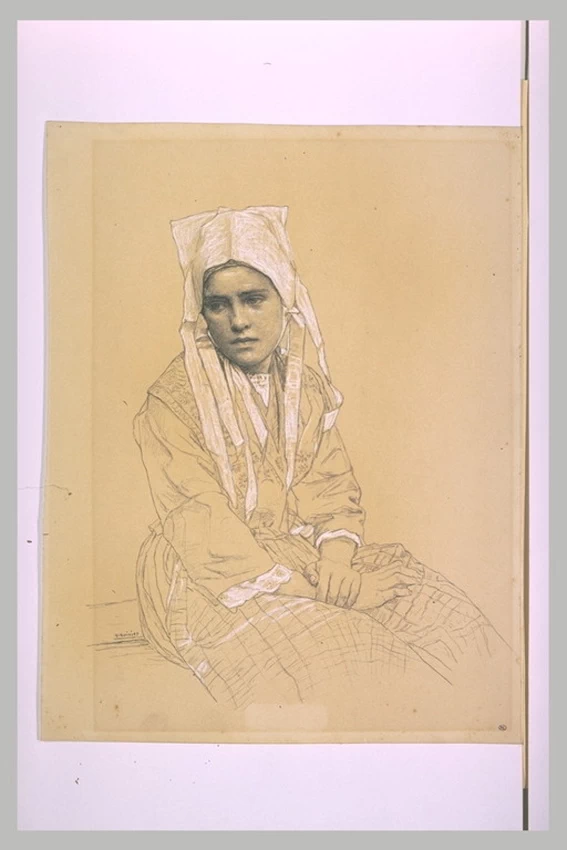 Giovane donna bretone seduta